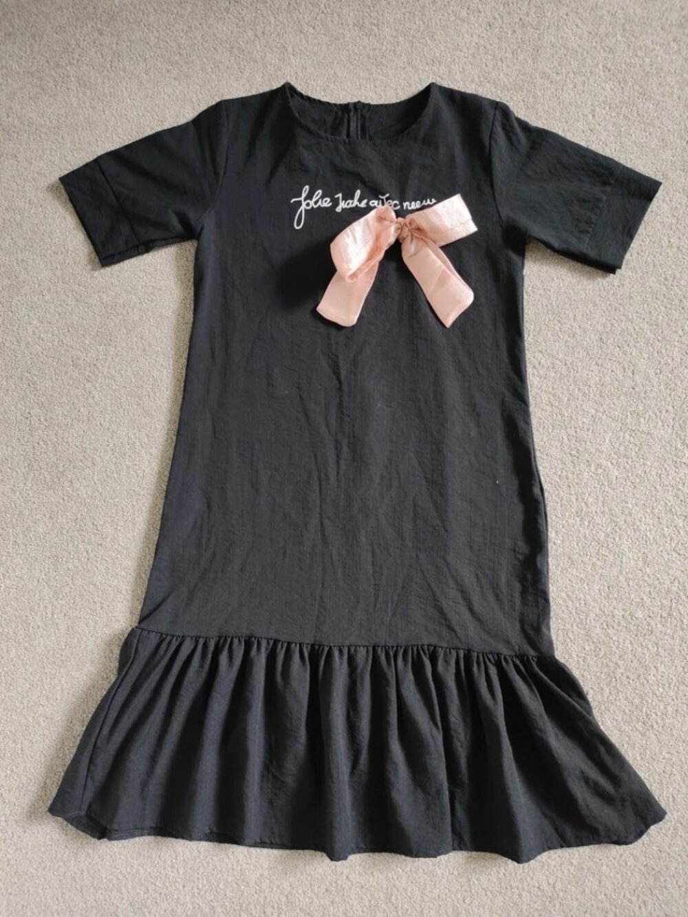 Black Mini Dress With Flared Skirt And Pink Bow